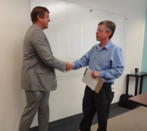 Rusty had opened hands for all the employees. Here he is seen shaking the hand of Tony Duncan, a Sr. Software Architect.